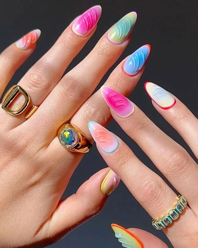 Hands with colorful nail art and rings