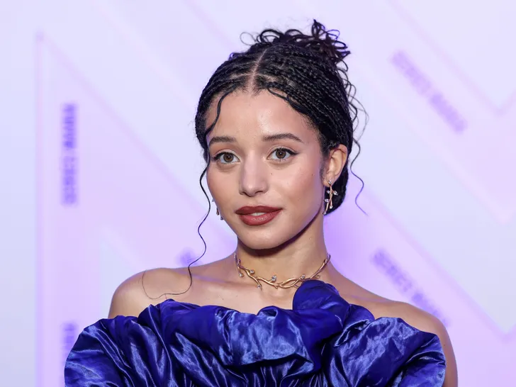 Individual with braided hairstyle attending an event