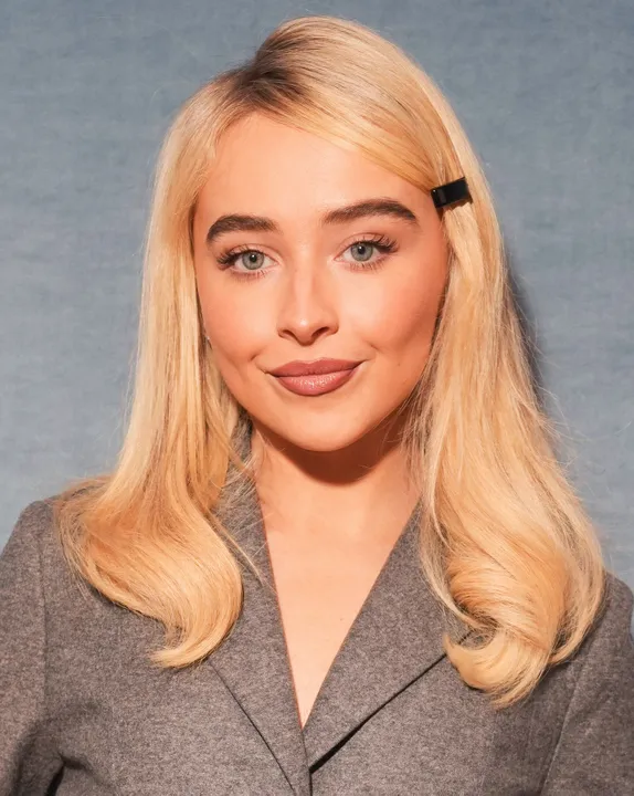 Sabrina Carpenter posing with a neutral expression